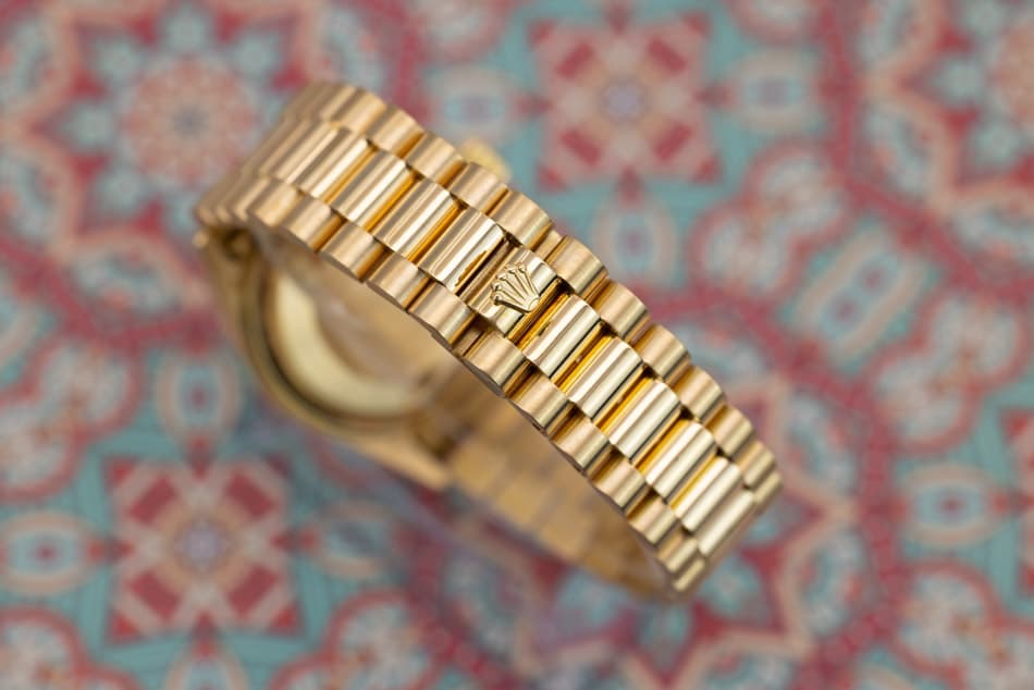 May be an image of wrist watch and jewelry