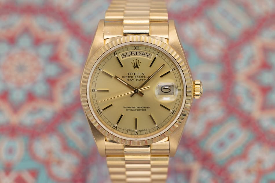 May be an image of wrist watch and text that says 'TXILLT SUNDAY W ROLEX OYSTER PERPETU ERPETU TUA 10 DAY-DATE AY- DATE IX 0 VIII SUPERLATIVE CHRONOMETER OFFICALLYCERTIFIED SUAO…