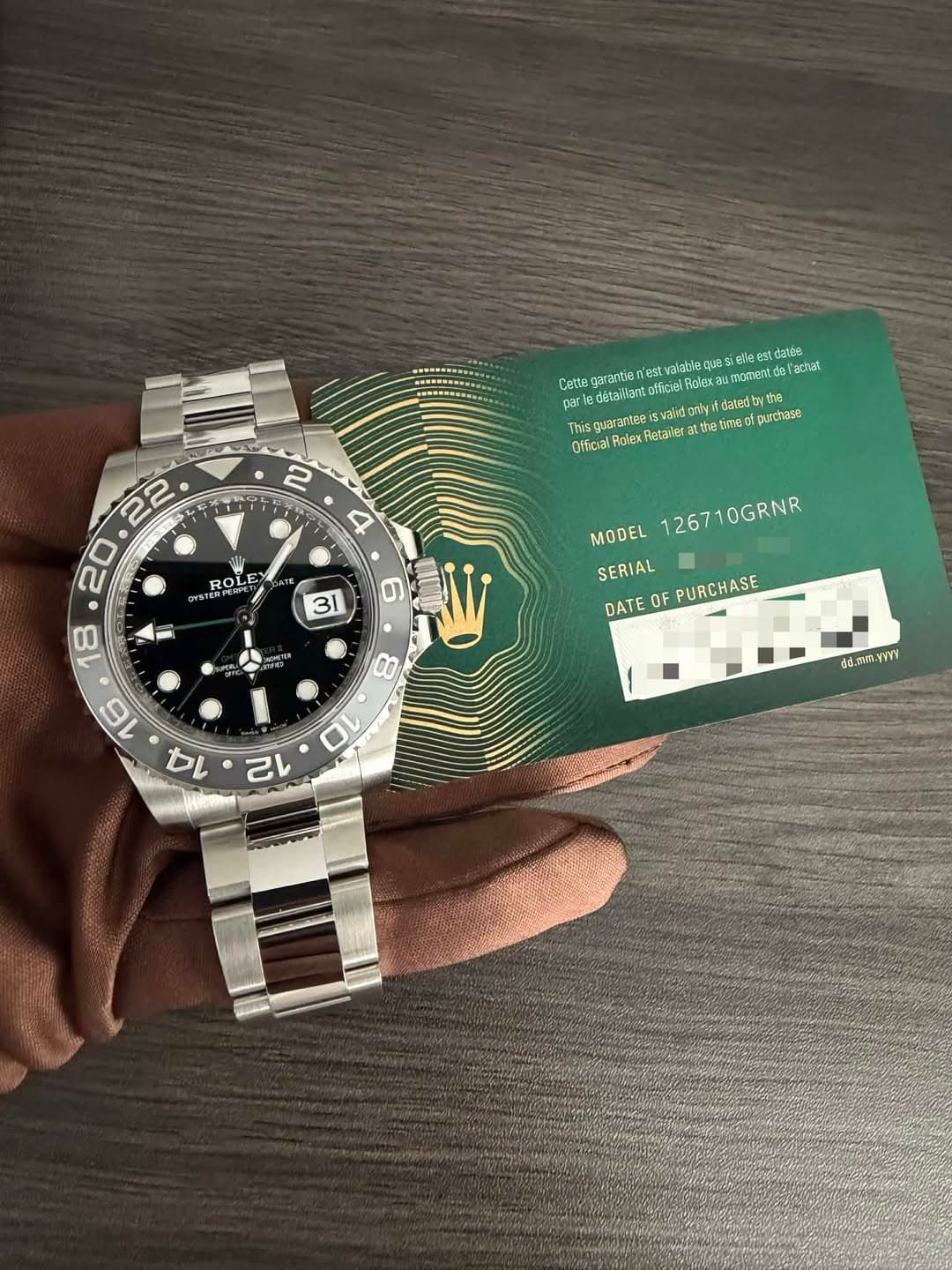 May be an image of ticket stub, wrist watch and text