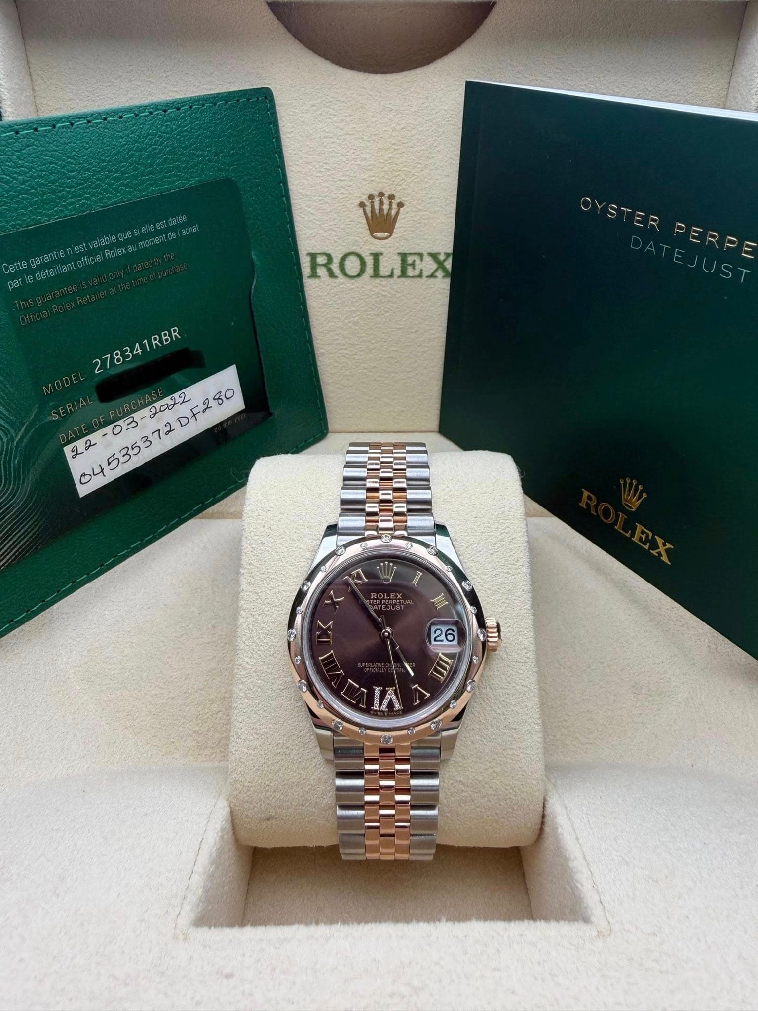 May be an image of wrist watch and text that says 'ifir ROLEX ERPE 278341RBR 278341RBR 04535372DF280 03- 2022 DF280 रा < < G 夏 a ወወንክ 26 6 10 ΙΛ'