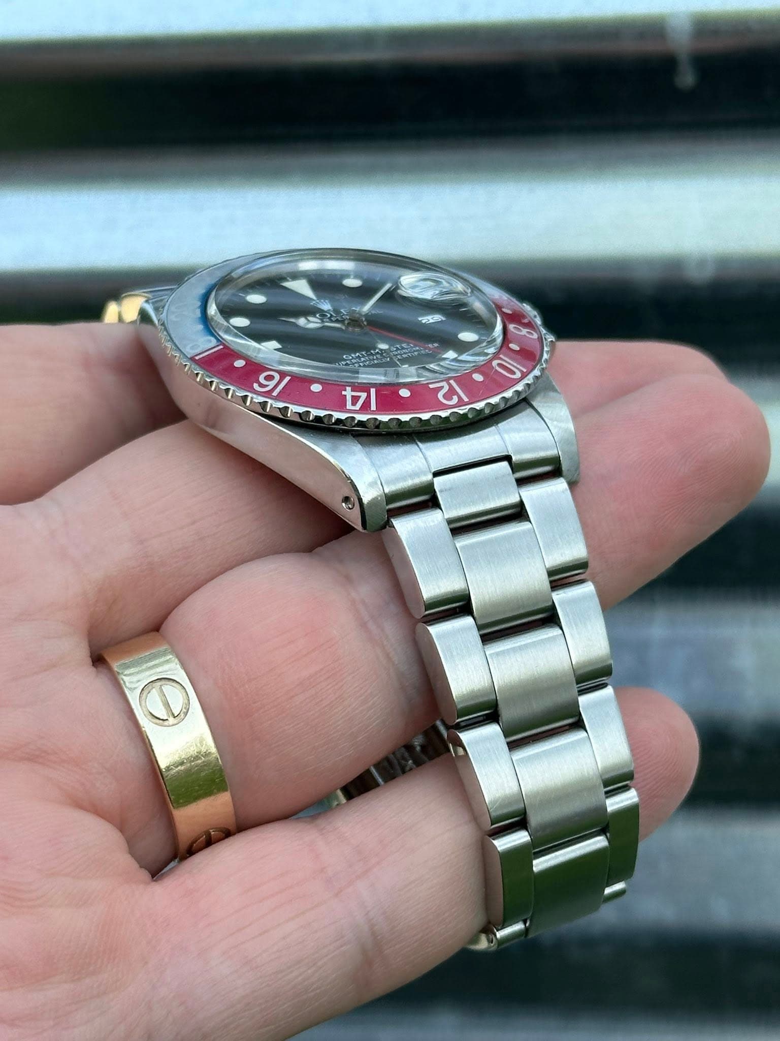 May be an image of wrist watch and text