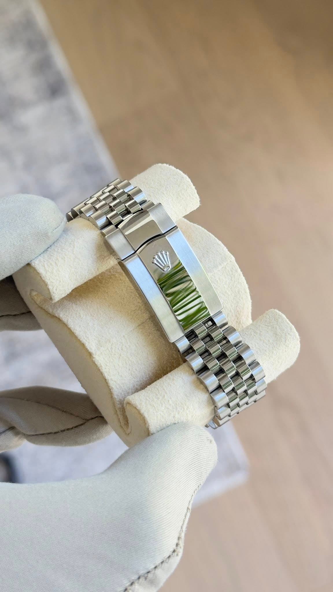 May be an image of wrist watch and jewelry
