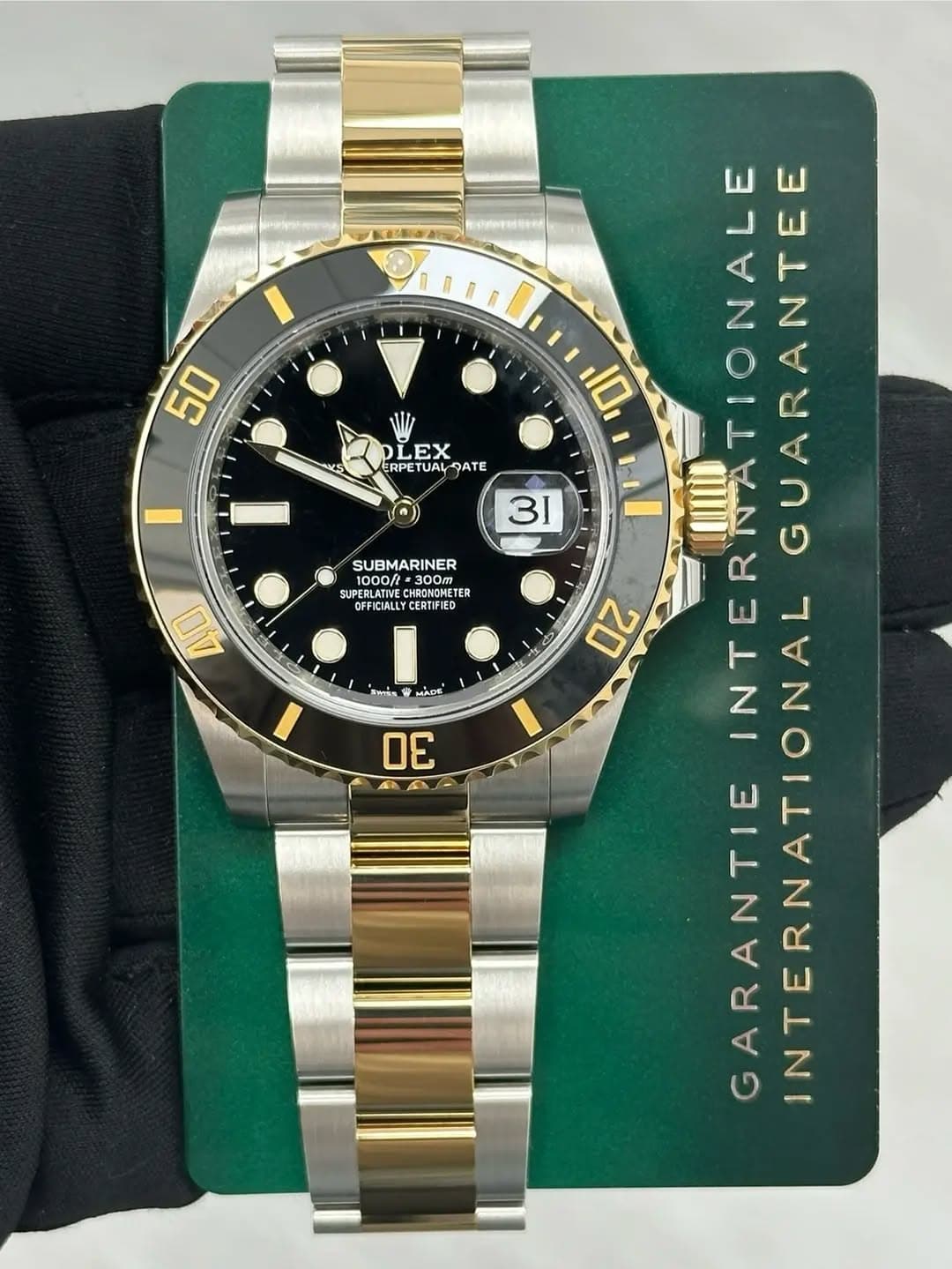 May be an image of wrist watch and text that says '50 wLS LEX ERPETUAL QATE SUBMARINER 1000/ 00 300m த்வ்.் TER OFFICIALLYCERTPIED LLYCERTIFIED 40 MADE โาพเจิ่อ 30 4B 10 31…