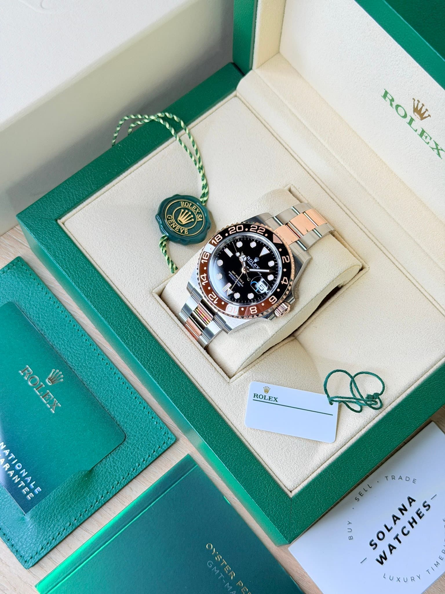 May be an image of wrist watch and text that says 'ROLEX T ENEVE جاره 2 8 ) 6 Uii W ROLEX A ATIONALE RANTEE GMT OYSTER SELL TRADE SOLANA የይ-ኑቅድም WATCHES- LUXURY'