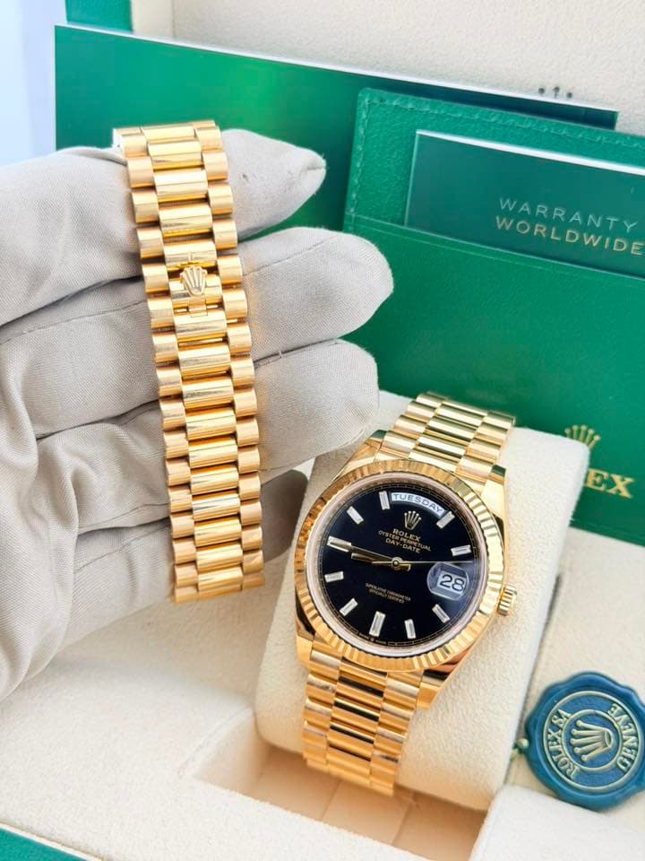 May be an image of wrist watch and text