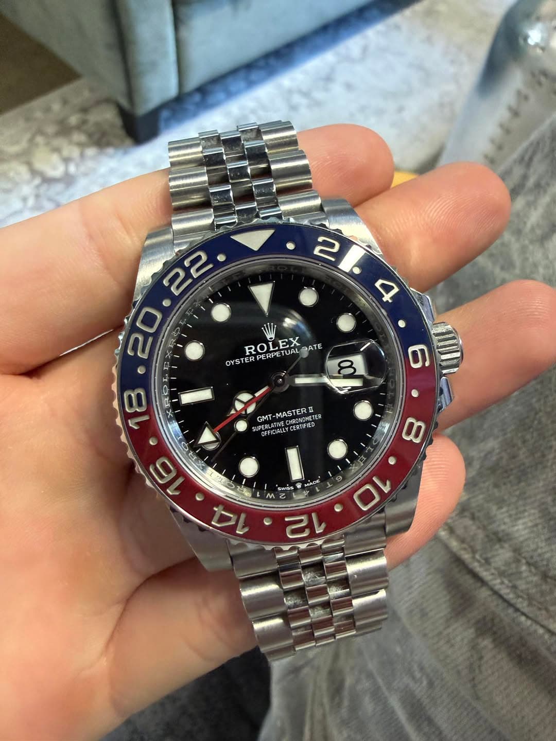 May be an image of wrist watch and text