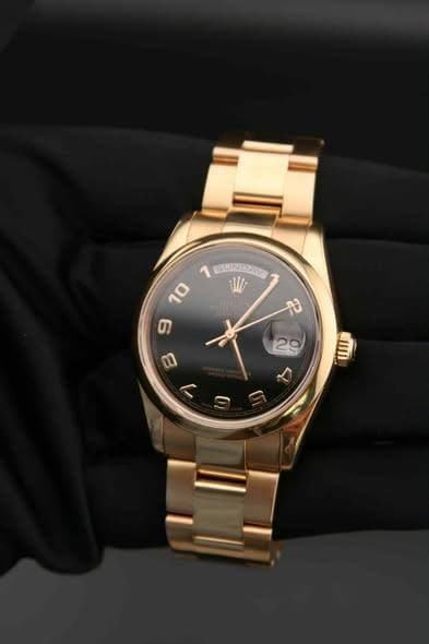 May be an image of jewelry, digital watch and text