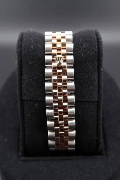 May be an image of wrist watch and jewelry