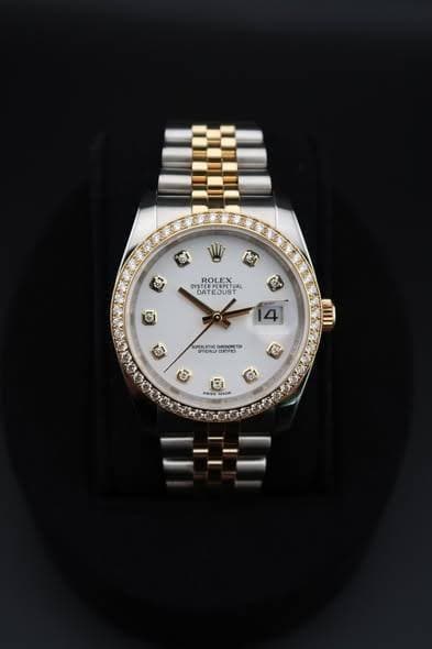 May be an image of wrist watch and text