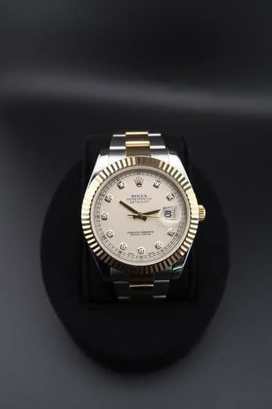 May be an image of wrist watch and text
