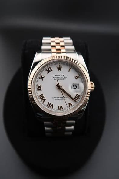 May be an image of wrist watch and text