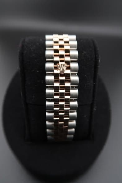 May be an image of jewelry and wrist watch