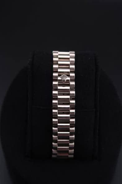 May be an image of wrist watch and jewelry