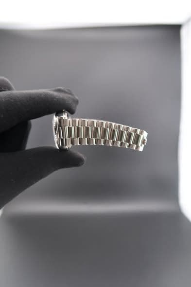 May be an image of wrist watch and jewelry