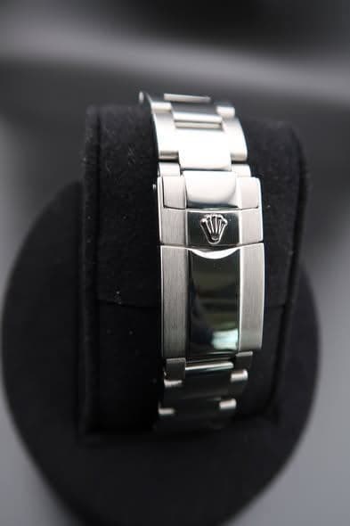 May be an image of digital watch, jewelry and text