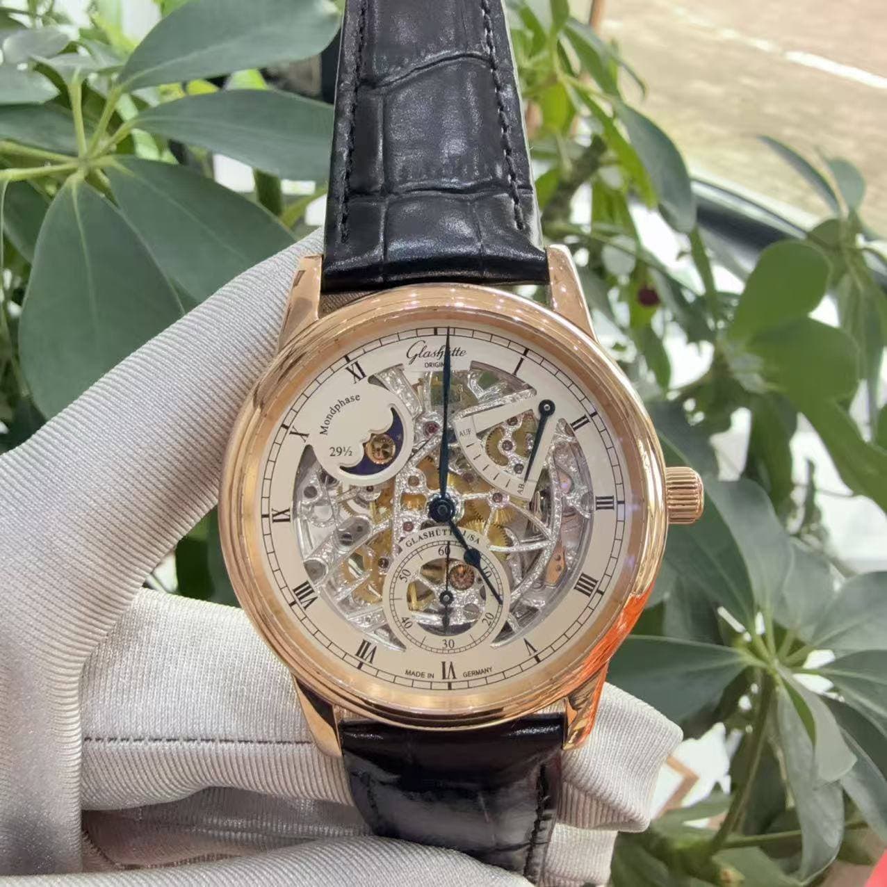 May be an image of wrist watch and text