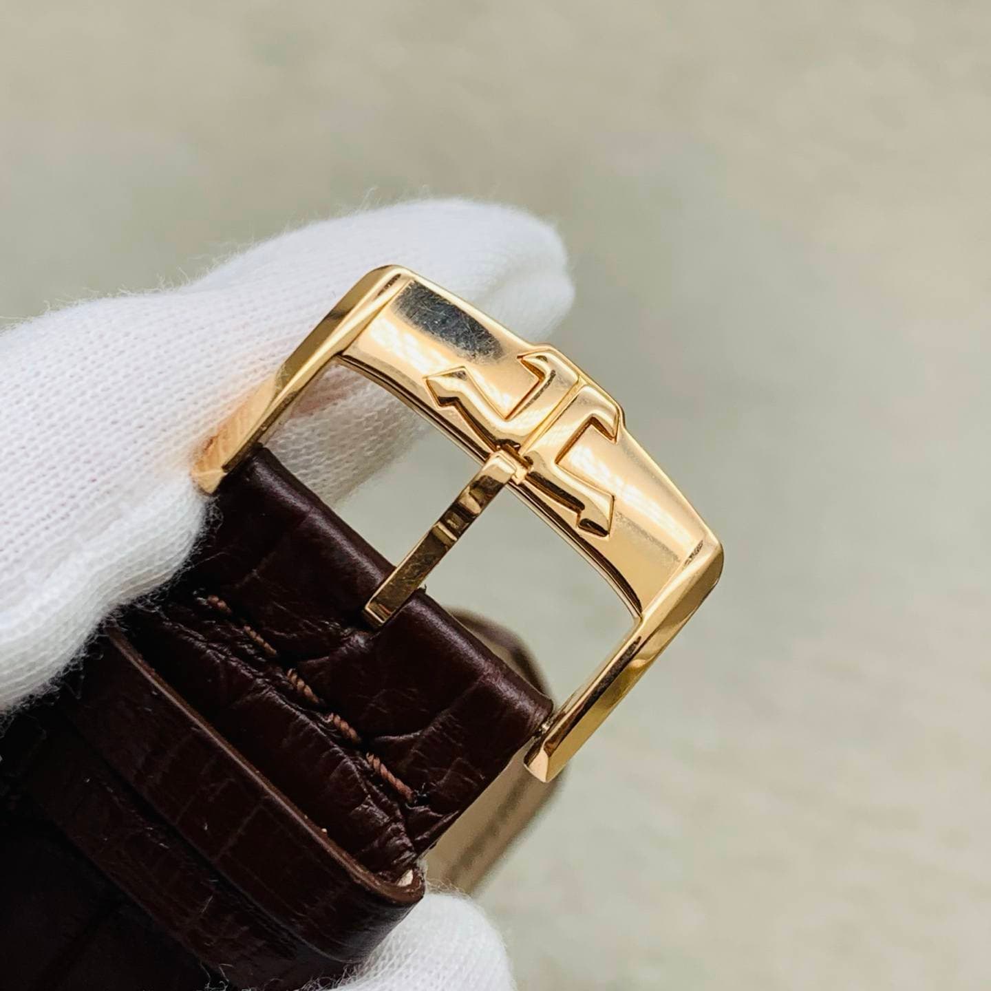May be an image of saddle-stitched leather and wrist watch