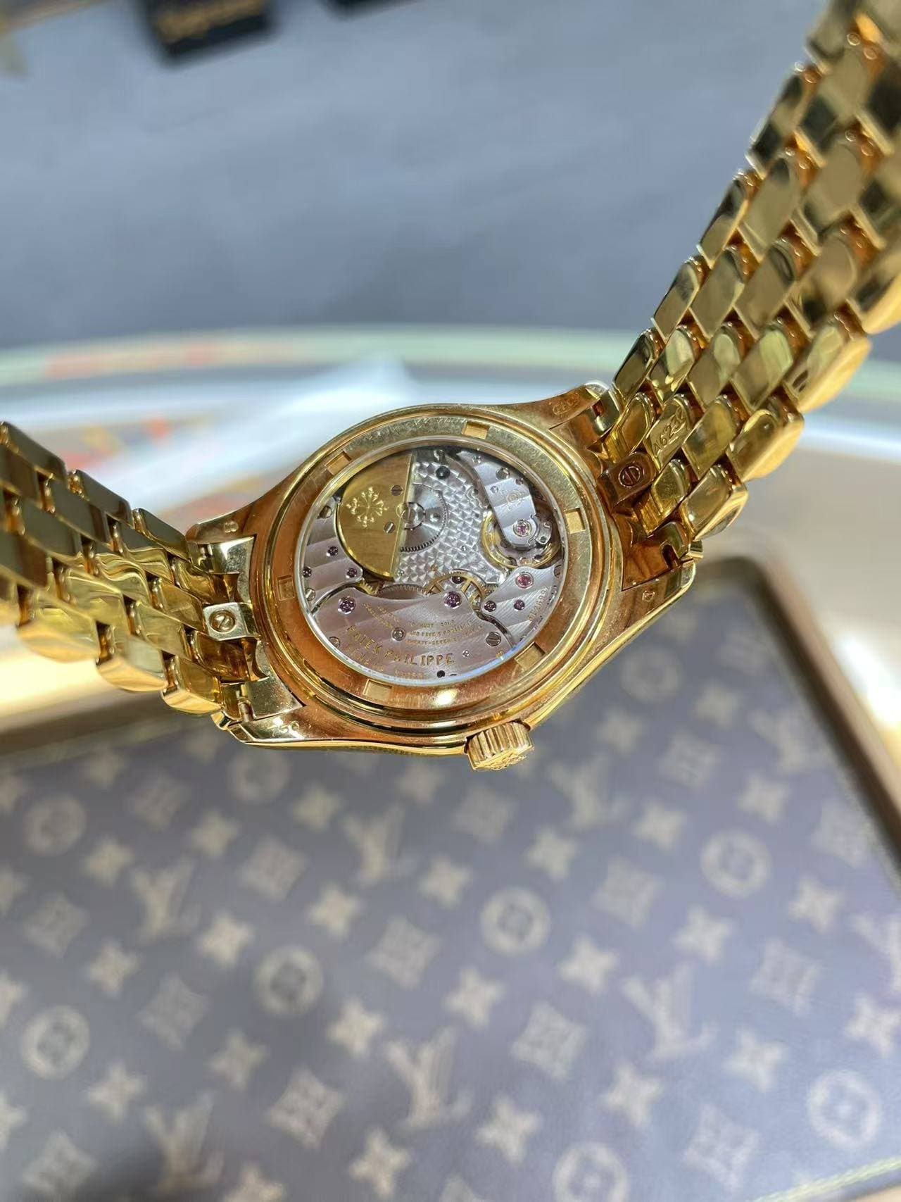 May be an image of wrist watch and text