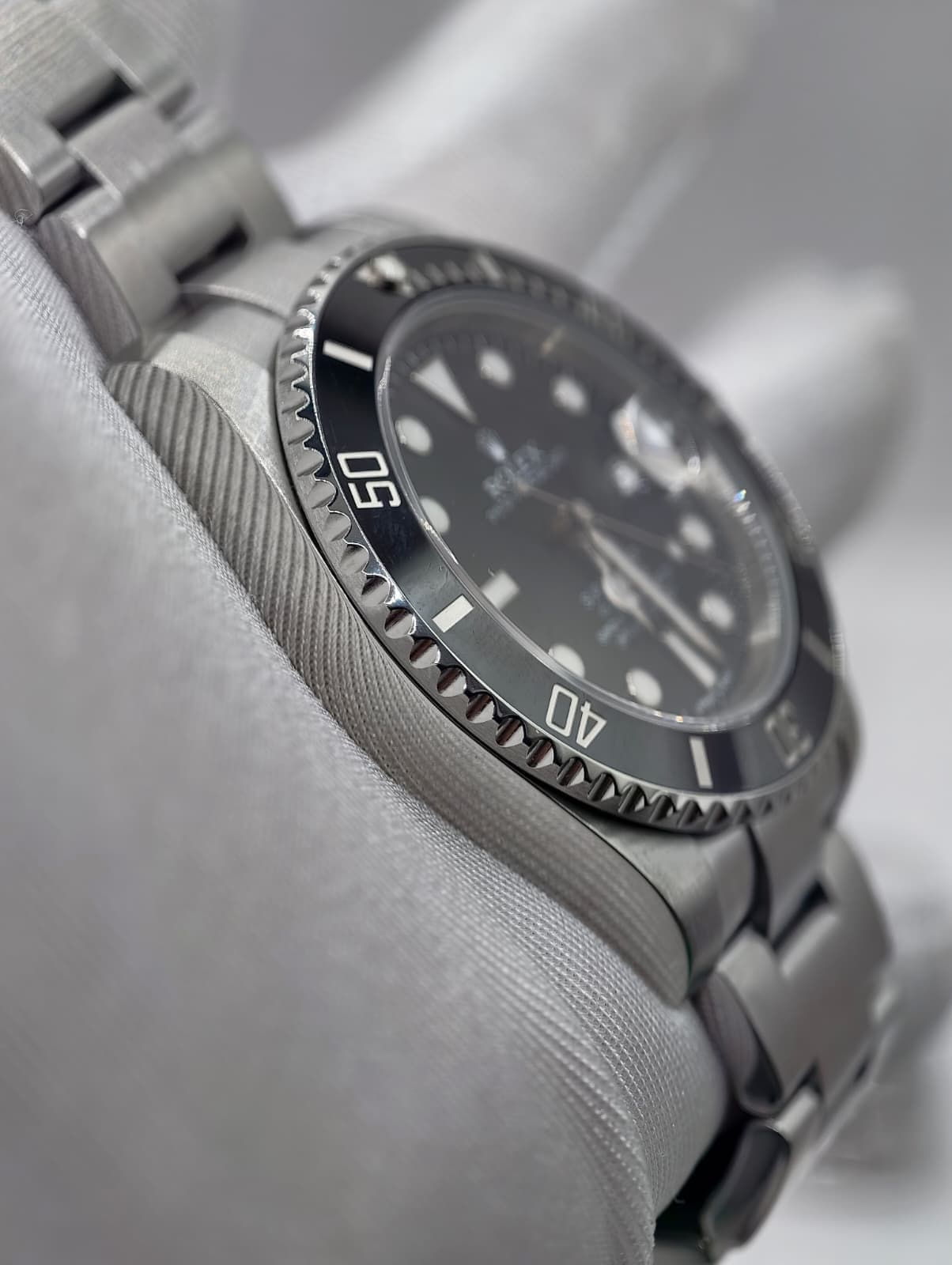 May be an image of wrist watch and text that says '١ 50 M'