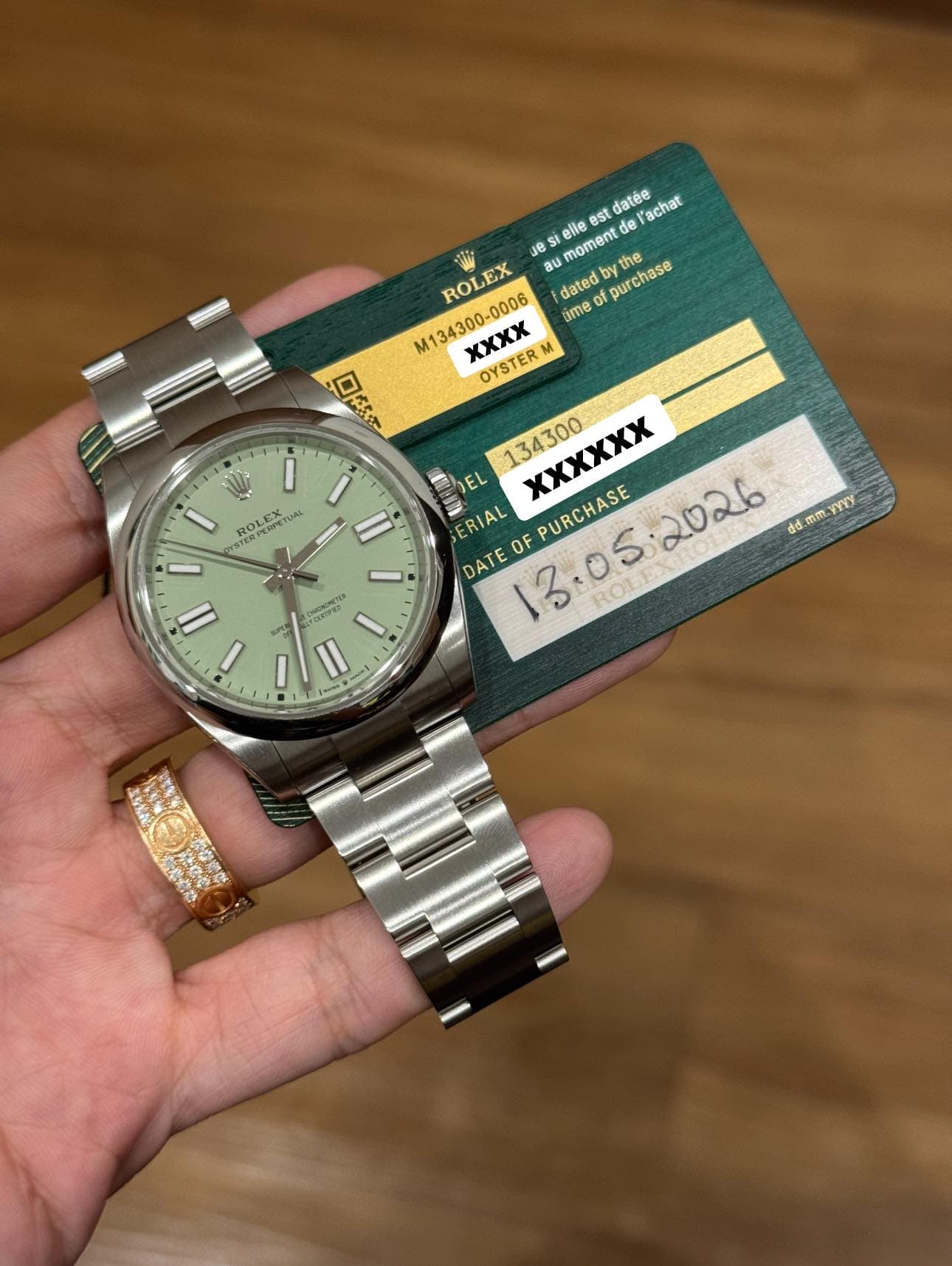 May be an image of wrist watch and text that says 'est noment del' datée achat elle e ROLEX dated Dyth the purchase pur M134300-0006 pu tme XXXX OYSTER M ロ本ダス 134300 XXXXXX…
