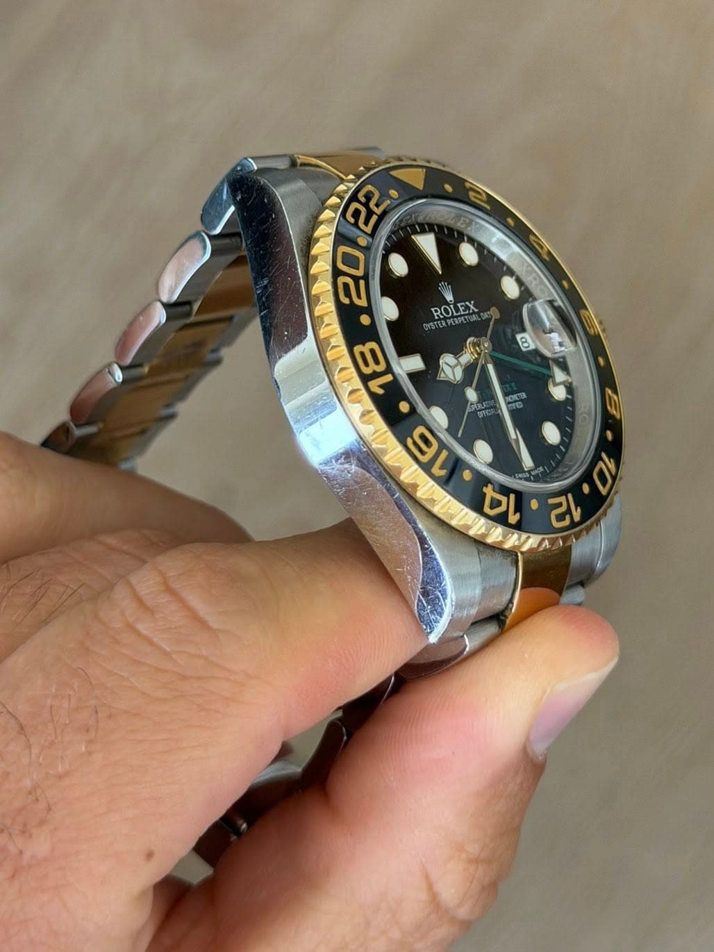 May be an image of wrist watch and text