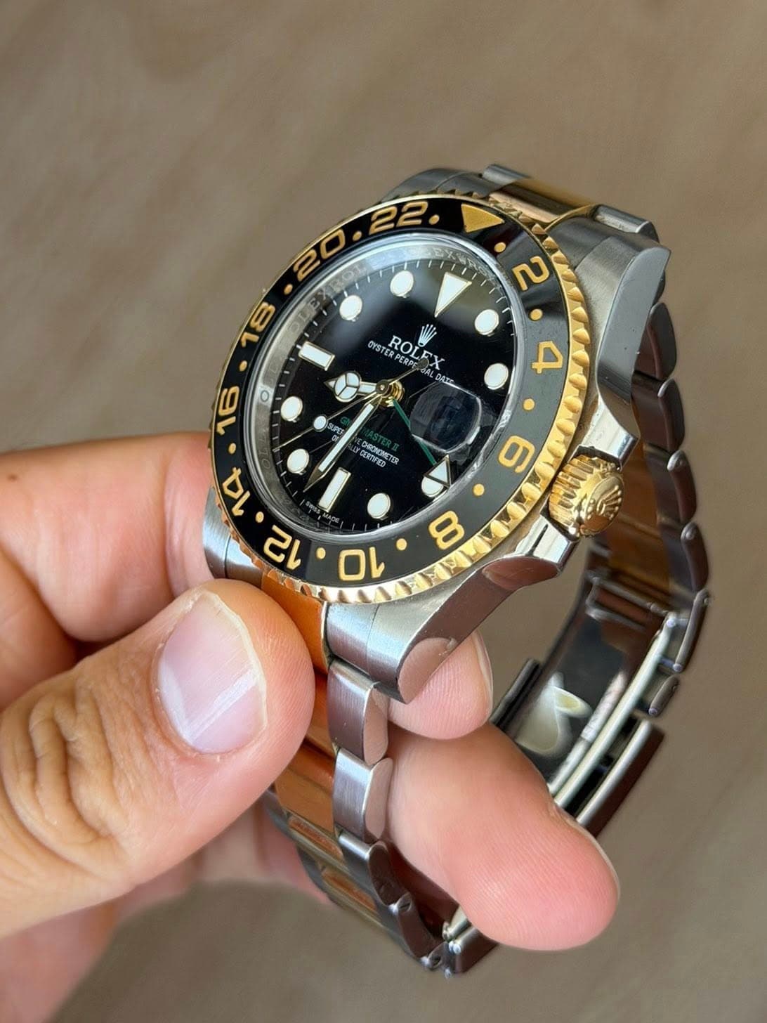 May be an image of wrist watch and text