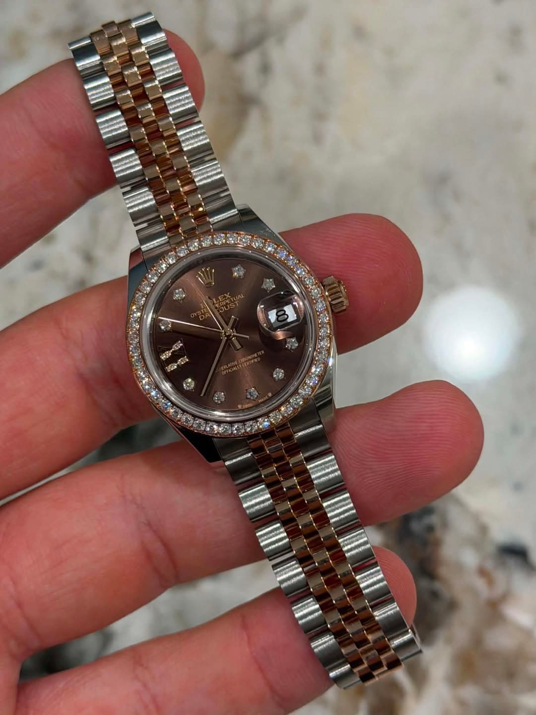 May be an image of wrist watch