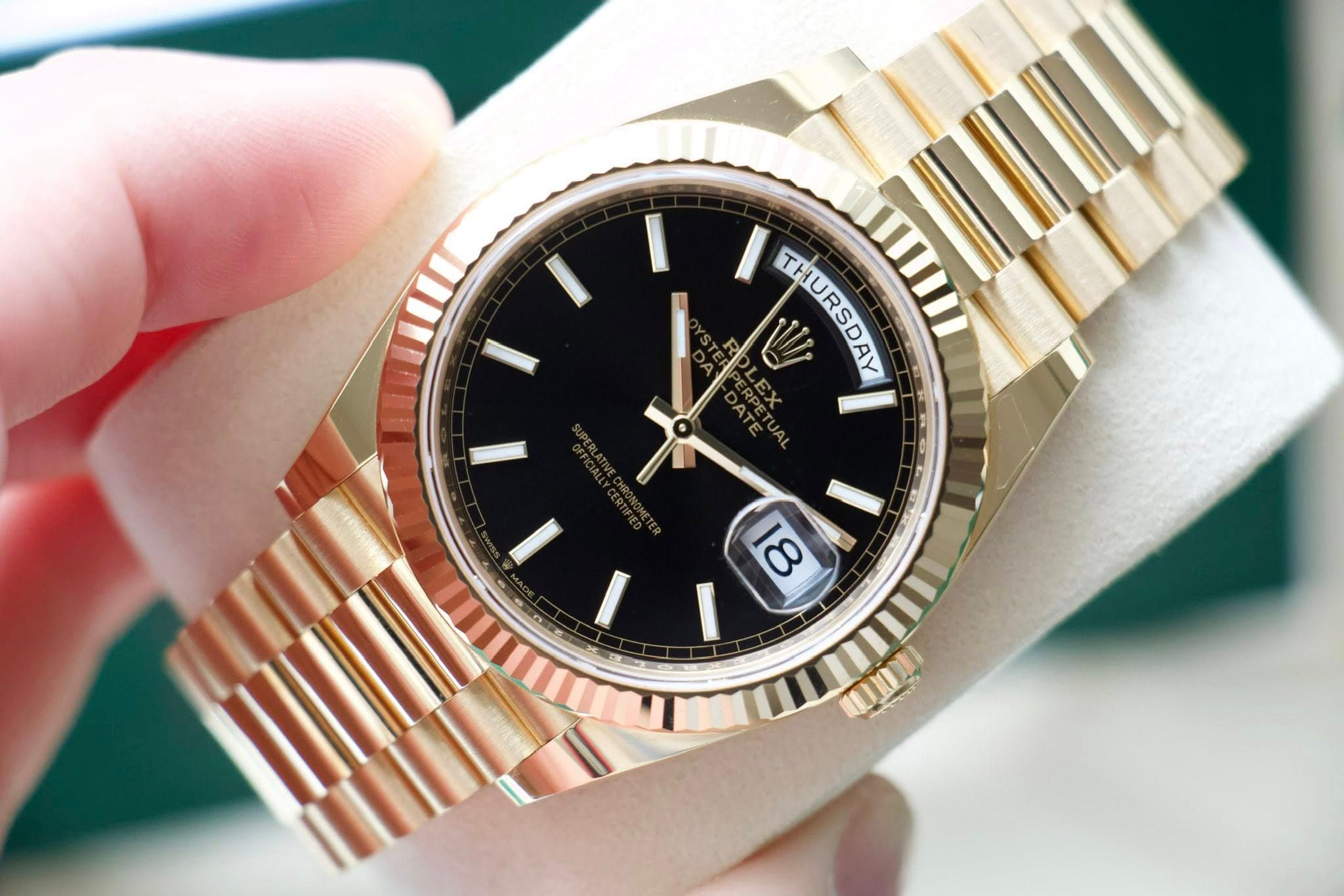 May be an image of wrist watch and text that says '0 THURSDAY THURSDAY 18'