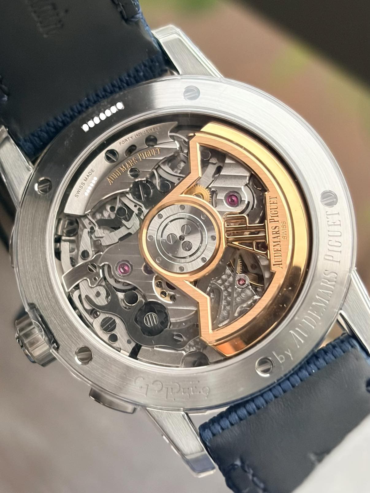 May be an image of wrist watch and text