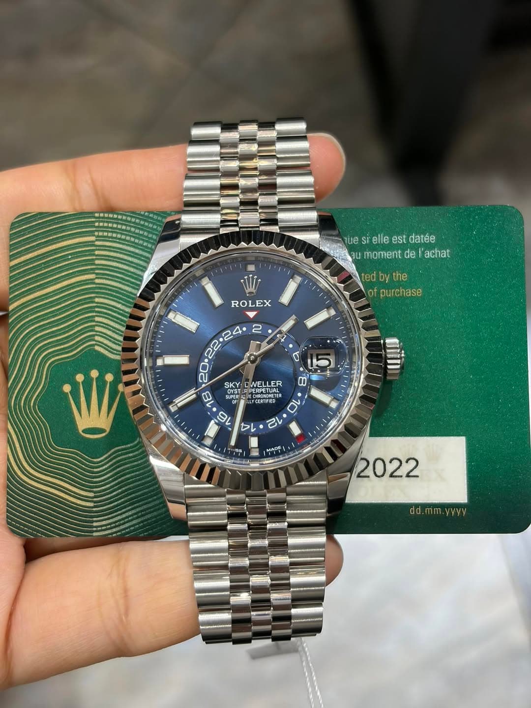 May be an image of wrist watch and text