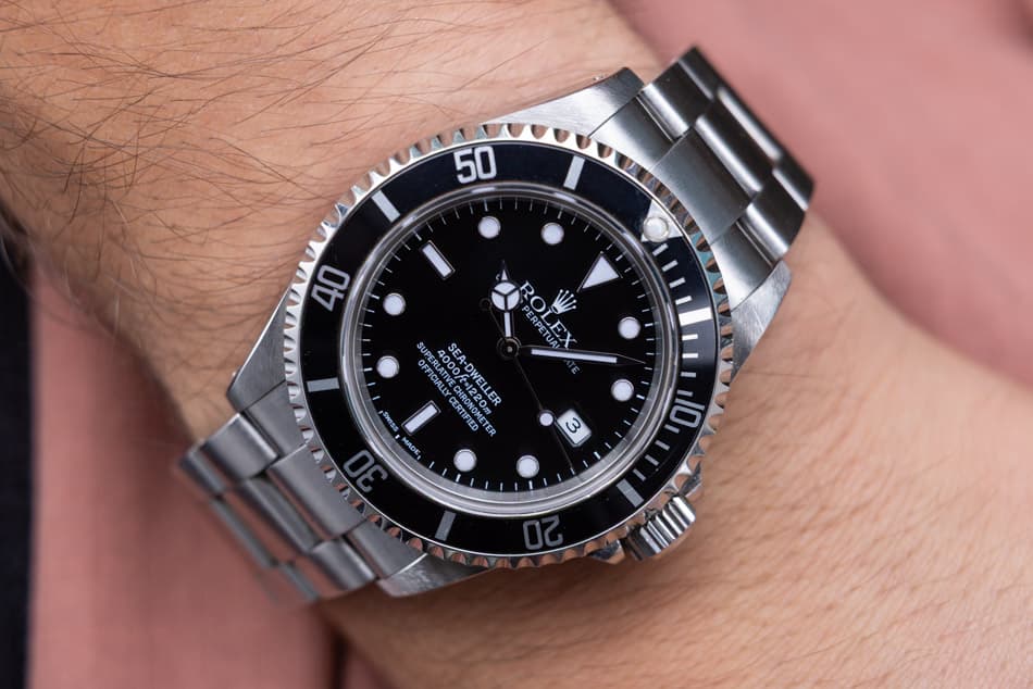 May be an image of wrist watch and text