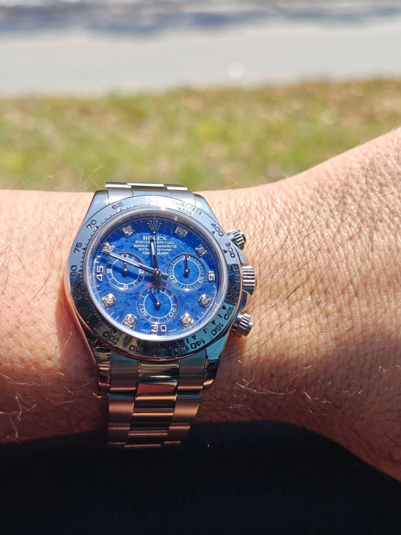 May be an image of wrist watch and text