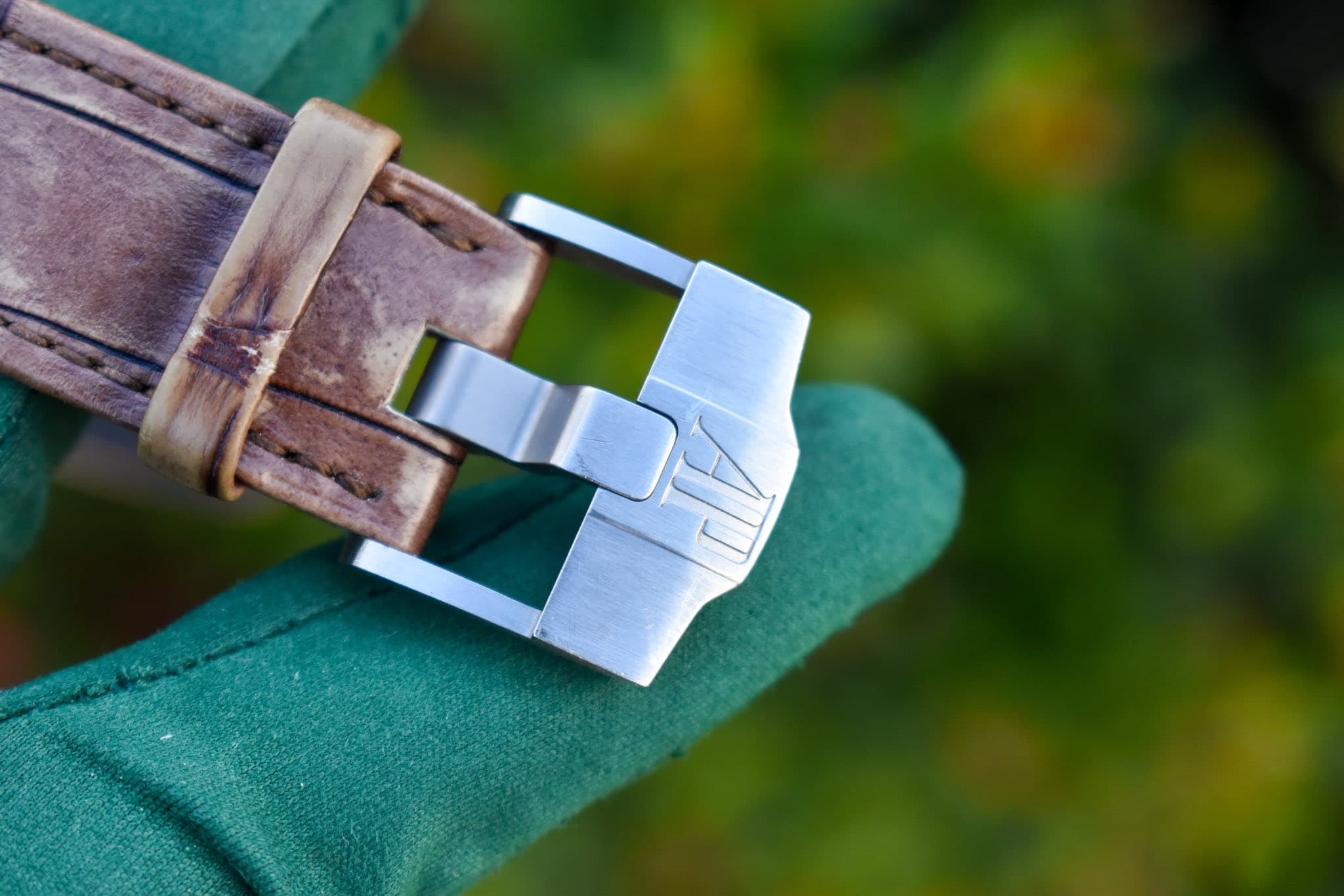 May be an image of saddle-stitched leather and wrist watch