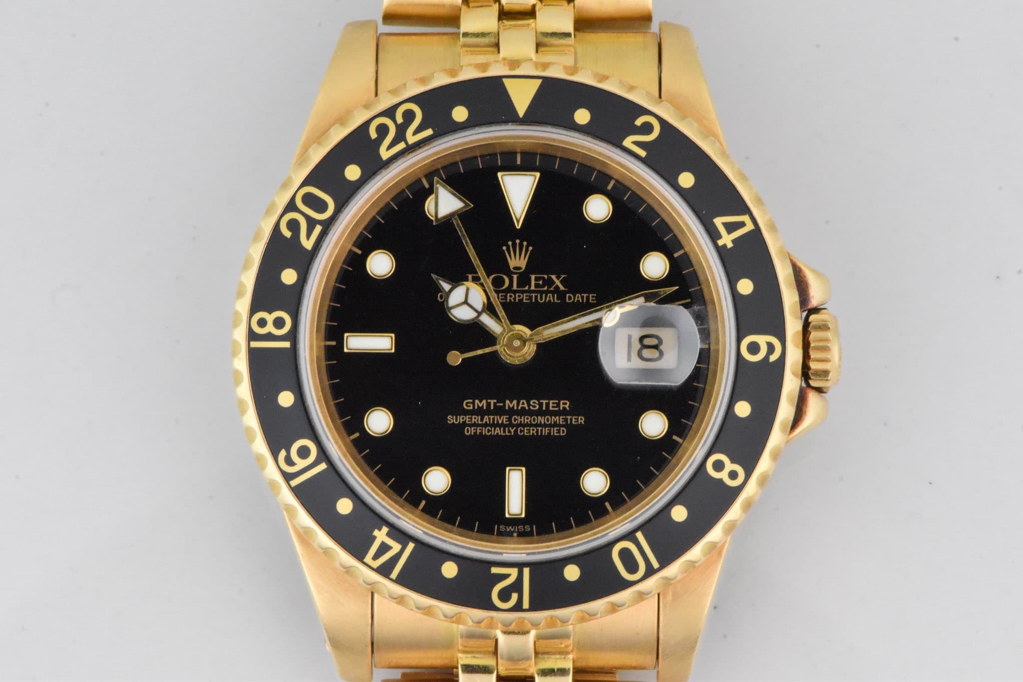 May be an image of wrist watch and text
