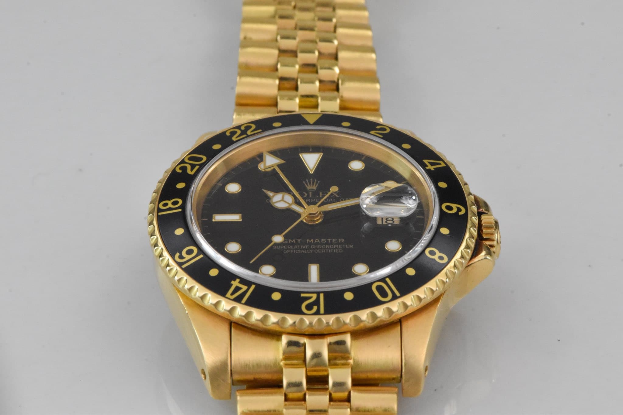 May be an image of wrist watch and text