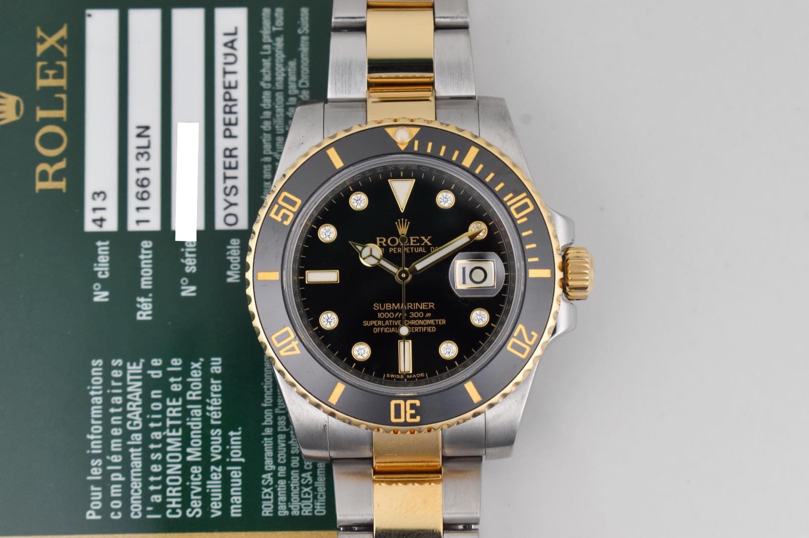 May be an image of wrist watch and text that says 'Chronométre ROLEX PERPETUAL fachat. 413 116613LN OYSTER parur client montre série Modéle No N°série N° Réf. 50 កត 10 1O 40 20…