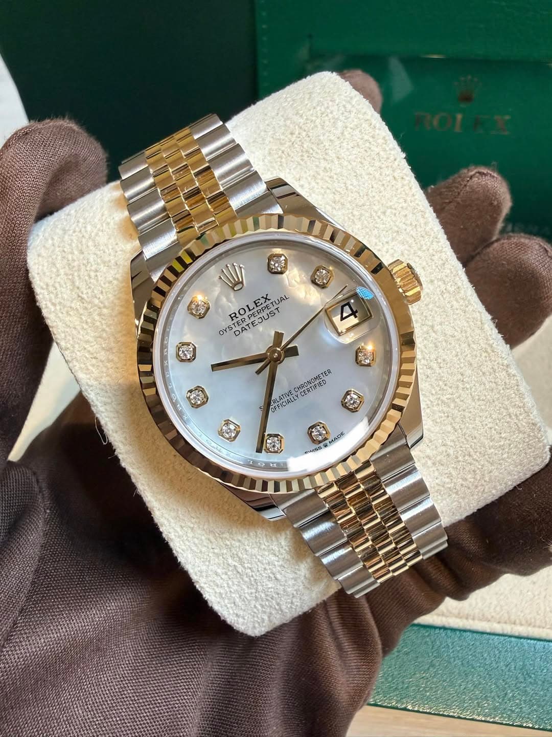May be an image of wrist watch and text