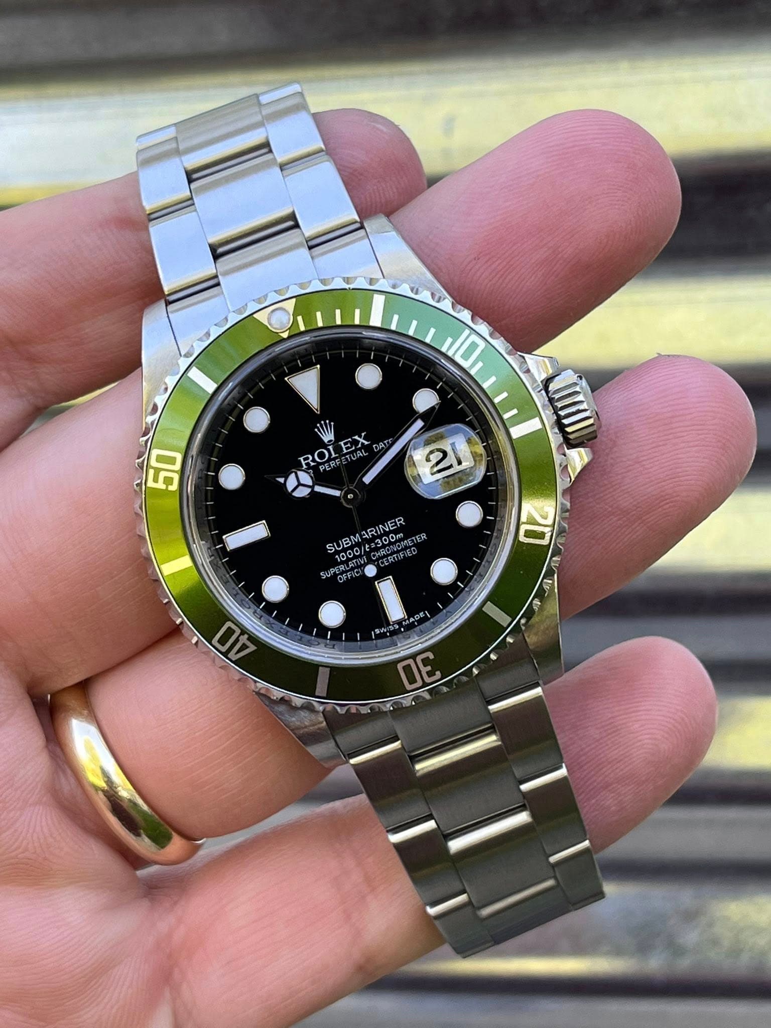 May be an image of wrist watch and text that says '10 ROL ROLEX ኢ m 50 21 SUBM ARINER 300m I 30'
