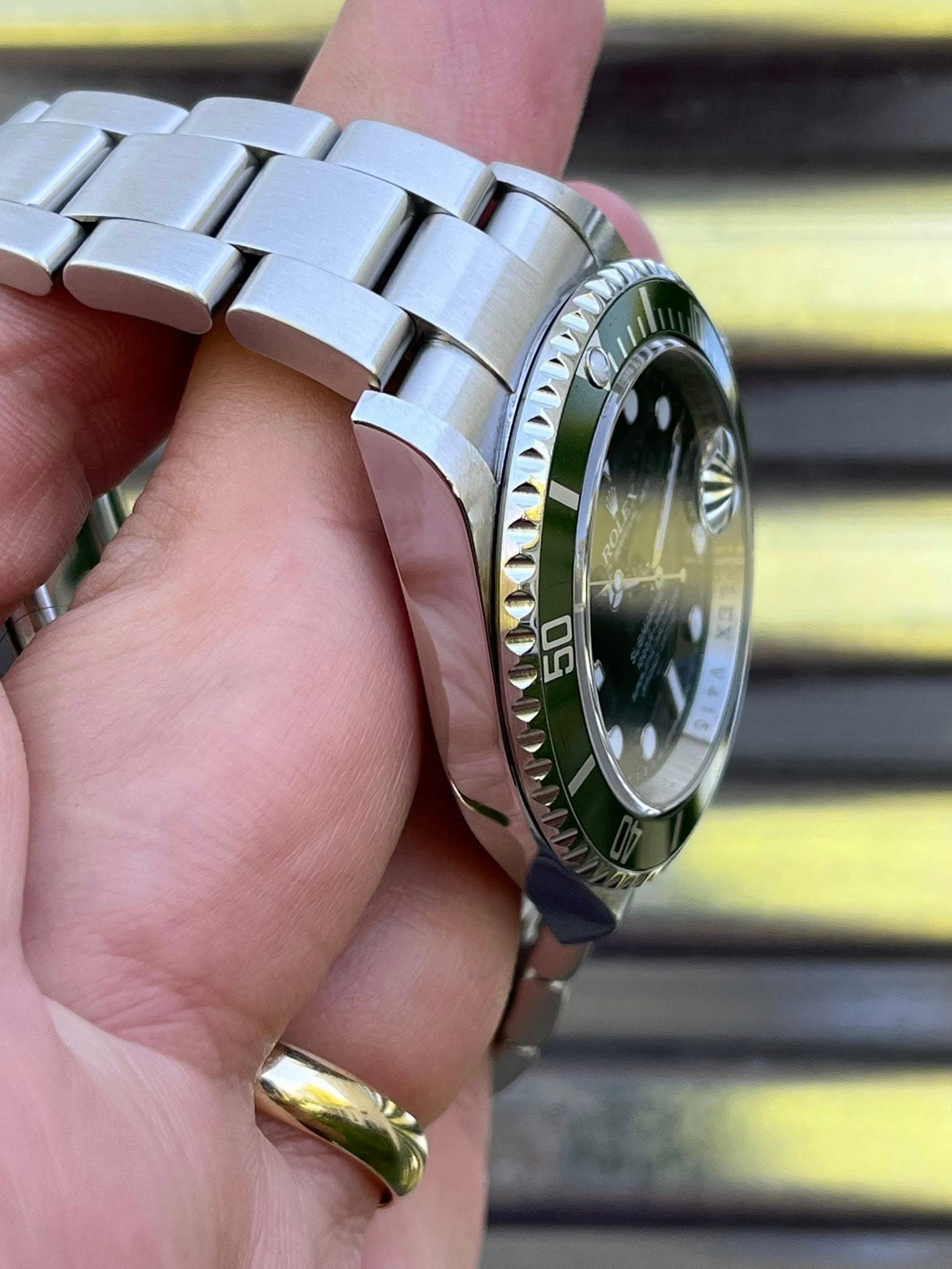 May be an image of wrist watch and text
