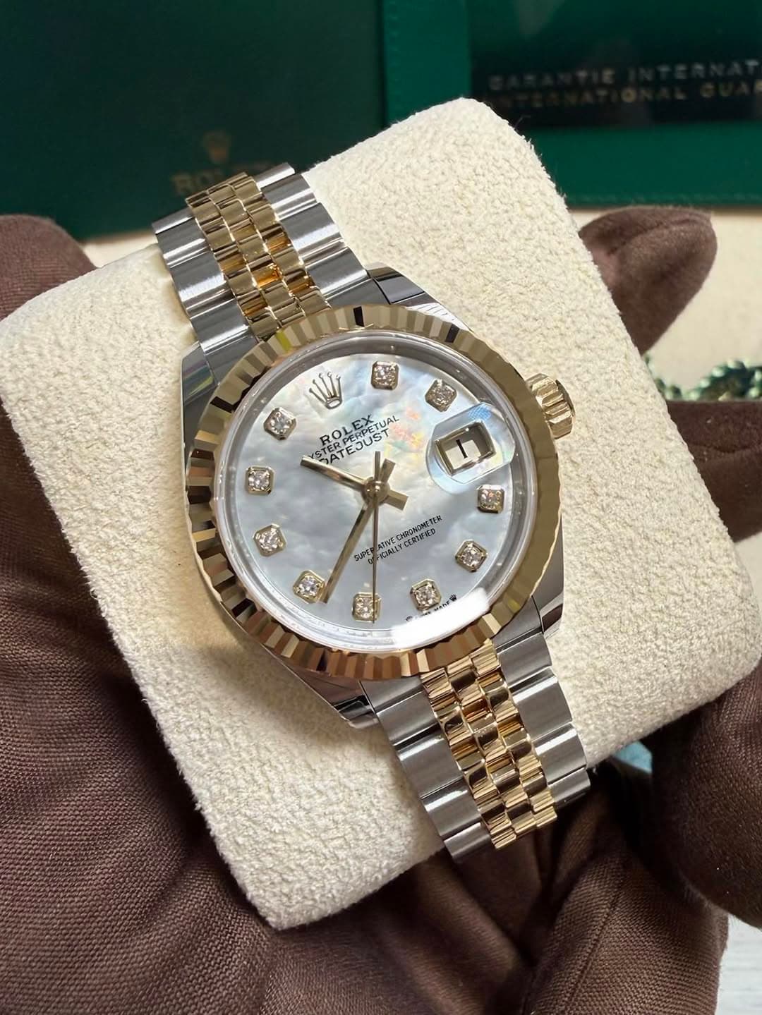 May be an image of wrist watch and text