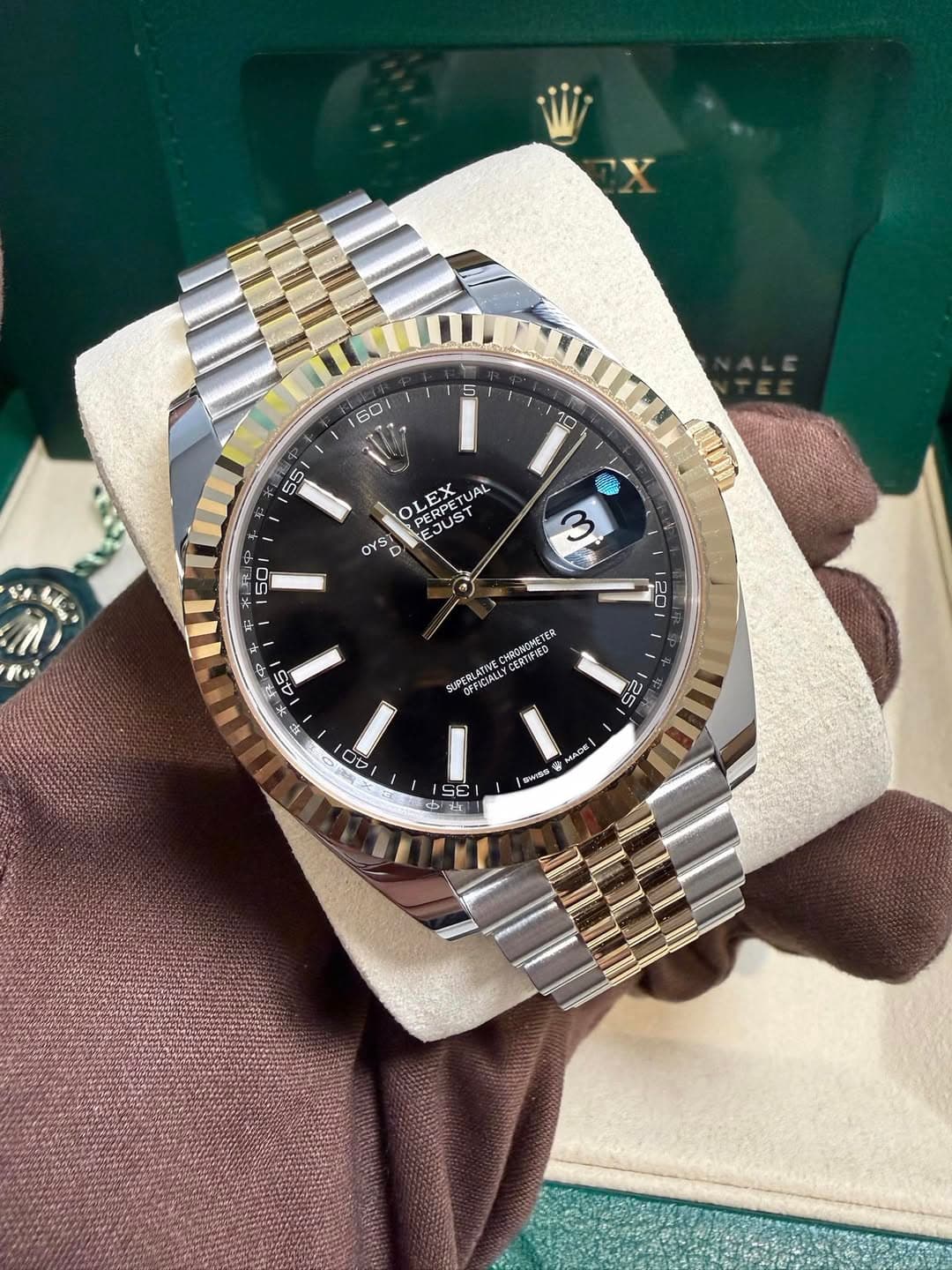 May be an image of wrist watch and text