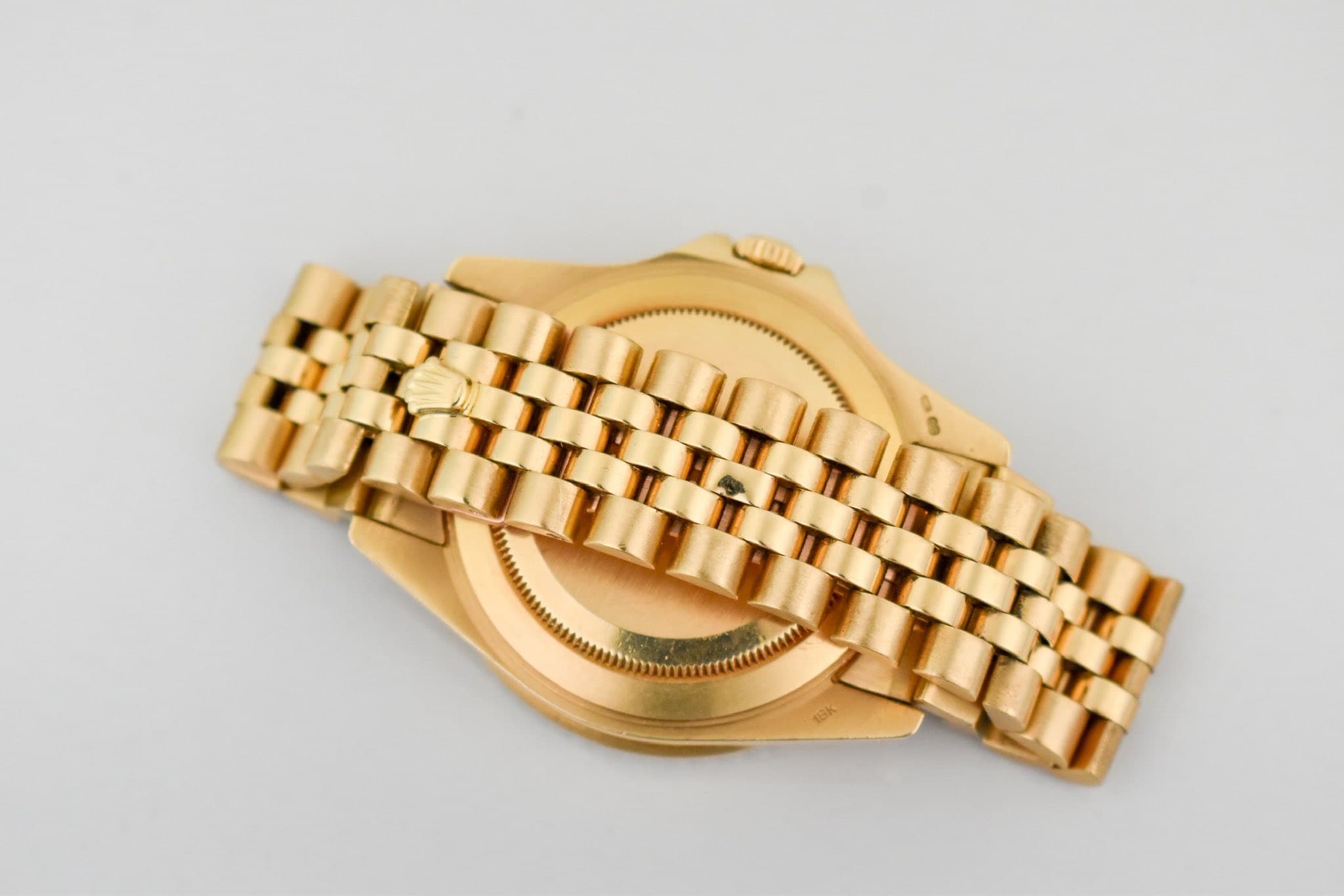 May be an image of wrist watch, jewelry and text