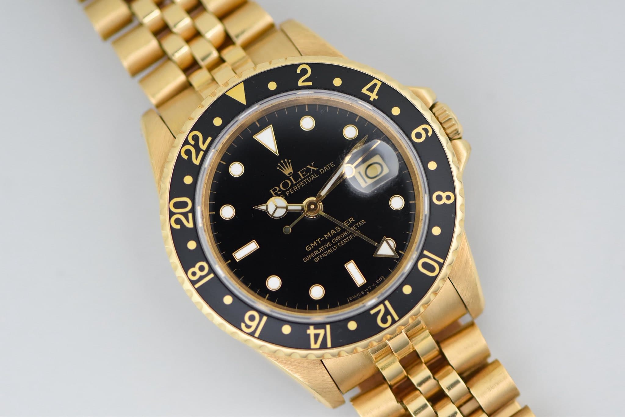 May be an image of wrist watch and text