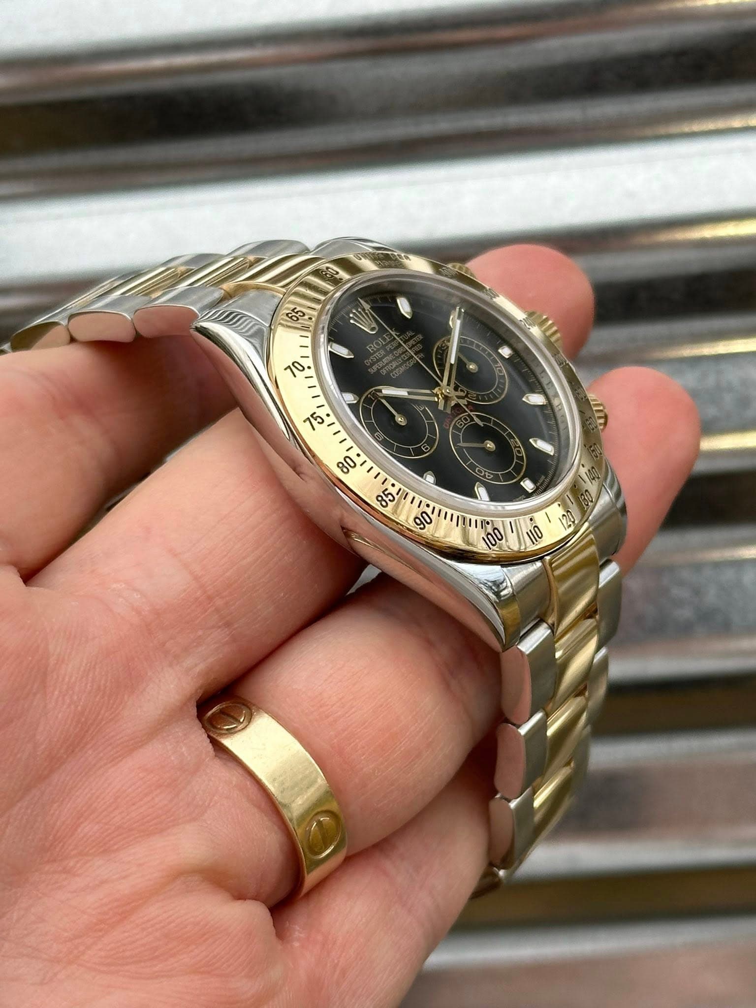 May be an image of wrist watch and text