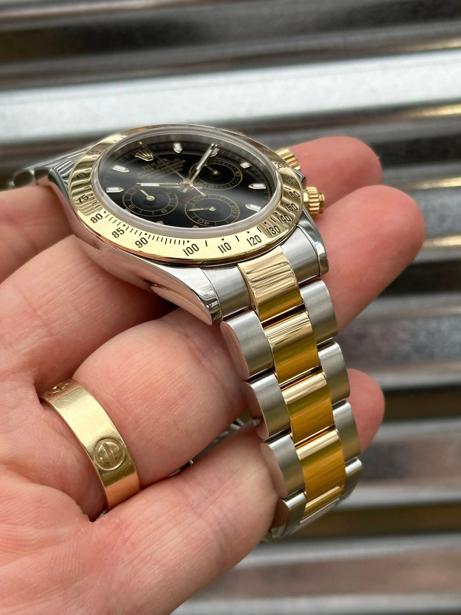 May be an image of wrist watch and text