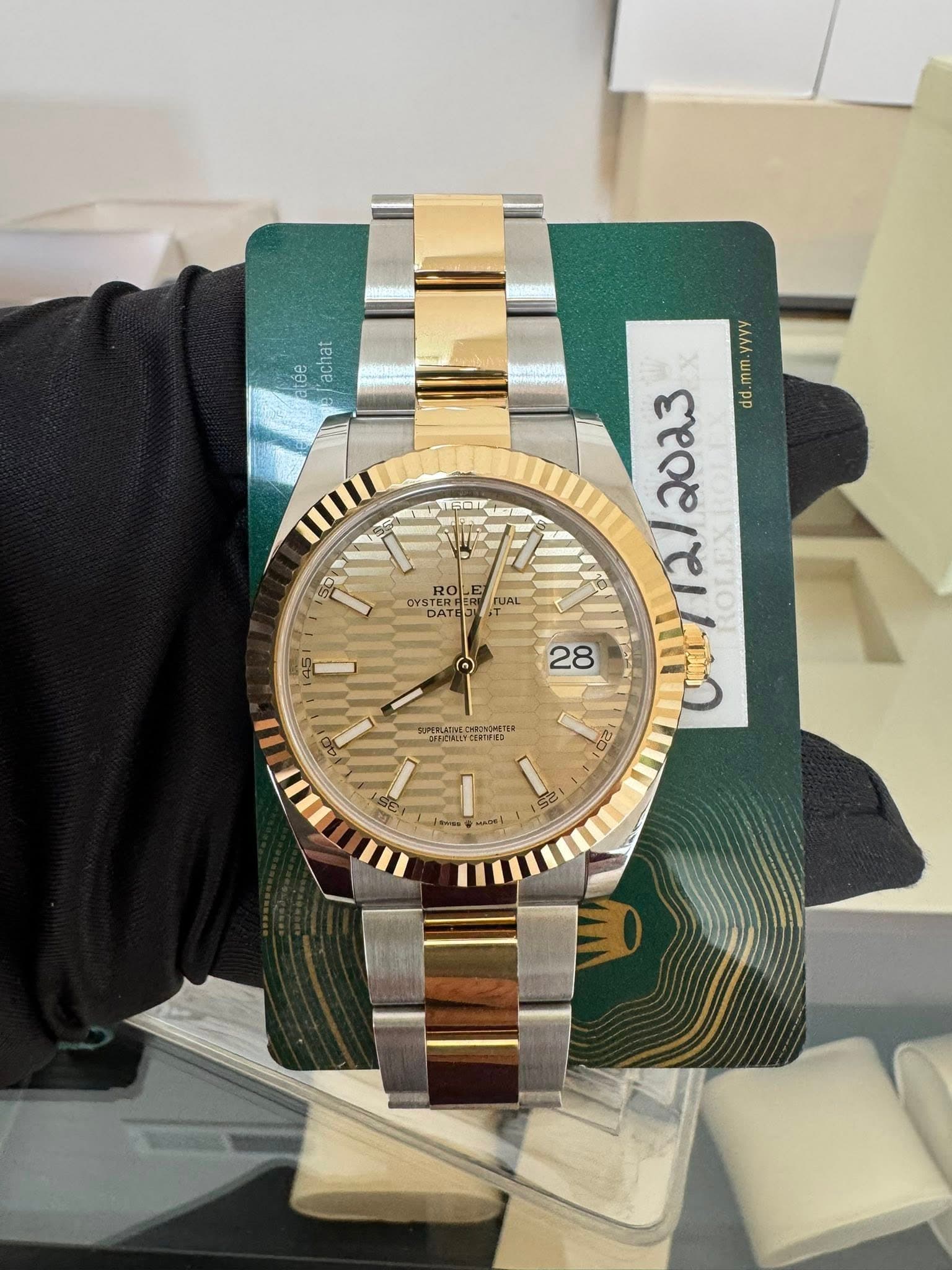 May be an image of wrist watch and text