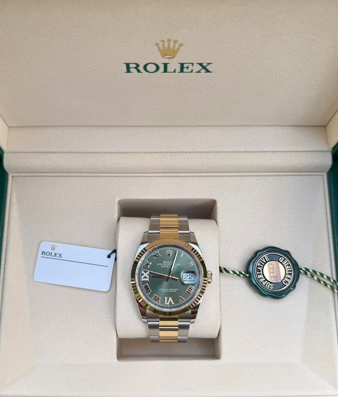 May be an image of wrist watch and text