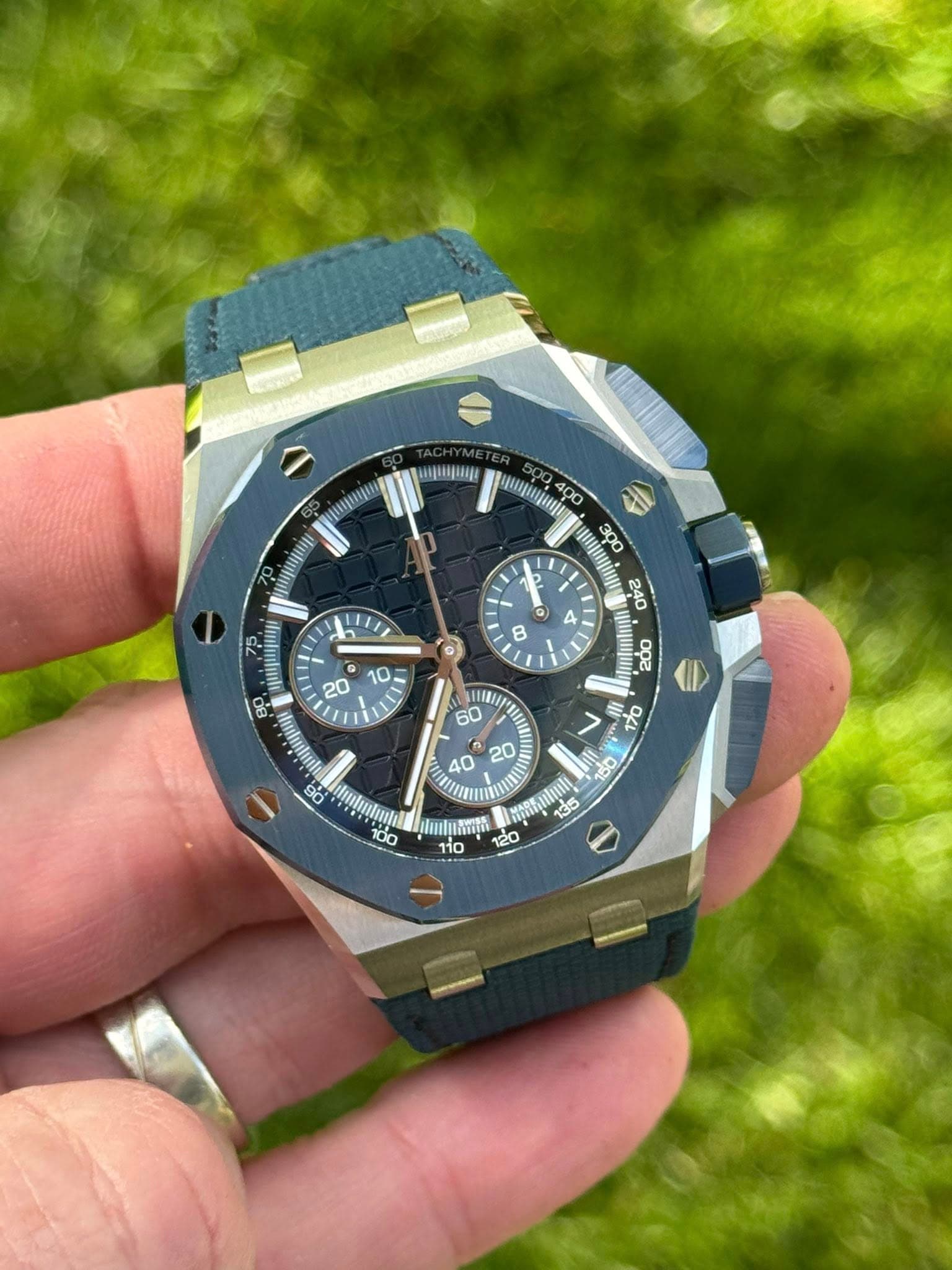 May be an image of wrist watch and text