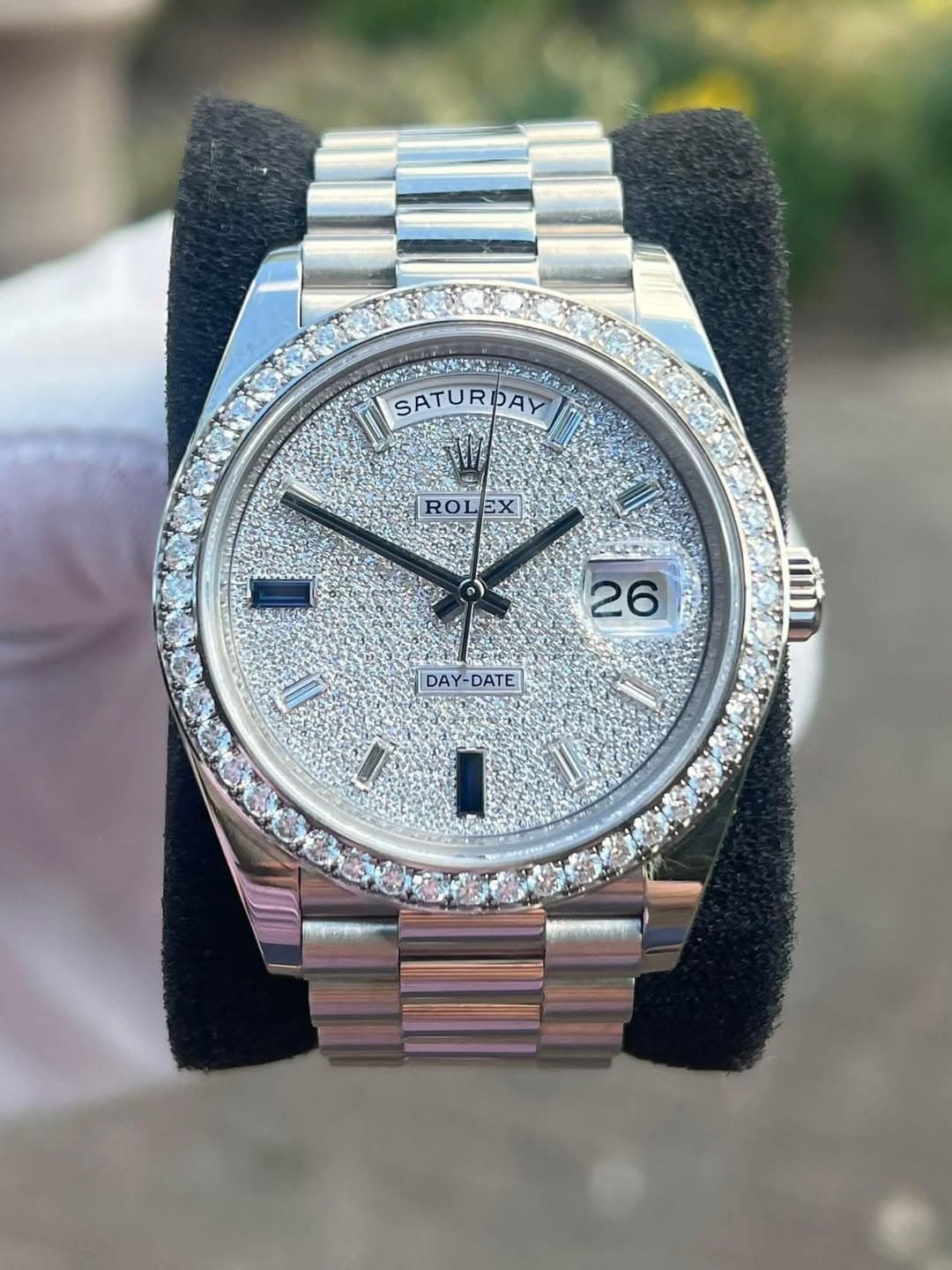 May be an image of wrist watch and text