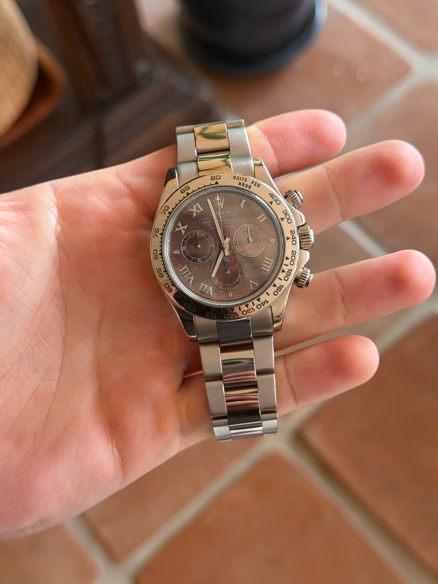 May be an image of wrist watch and text